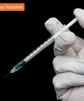 Gloved hand holding disposable sterile 1ml syringe with 31G 8mm needle, suitable for insulin and precise dosing, black background.