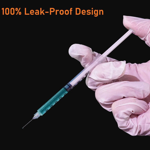 Gloved hand holding Disposable 1ml Syringe With Cap 31G One Quarter Inch 6mm Sterile Individually Packed Pack Of 20 showing leak-proof design