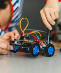 Person assembling a small wheeled robot using screws from 1760pcs M2 M3 M4 M5 Metric Screw Assortment, Grade 12.9 Alloy Steel kit