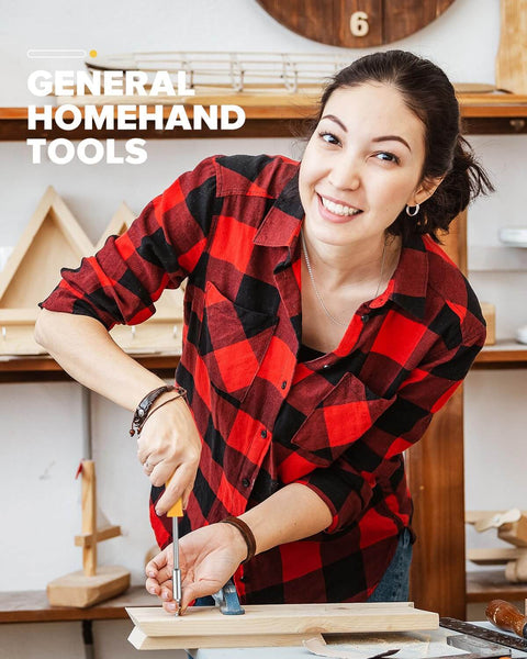 Person using a screwdriver on a wooden project in a workshop setting.