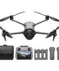 DJI Mavic 4 Pro Fly More Combo With DJI RC 2 Tri Camera Drone Featuring 100MP Four Thirds CMOS Hasselblad Main Sensor And Dual Tele Cameras, 30 km Video Transmission, 51 Minute Max Flight Time, Charging Hub And Accessories displayed with controller and batteries.
