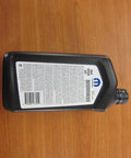 Chrysler Dodge Jeep Ram 8 And 9 Speed Automatic Transmission Fluid New OEM Genuine ATF bottle on wooden surface.