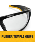 Close-up of Dominator Z87 Plus Safety Glasses with black full frame and clear lenses, highlighting rubber temple grips.