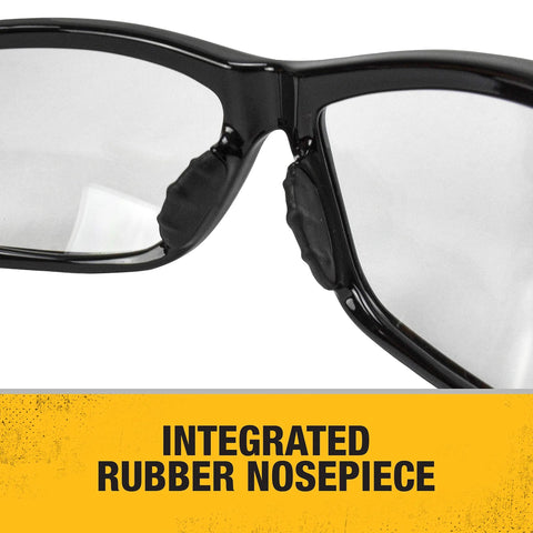 Close-up of Dominator Z87 Plus Safety Glasses with black full frame, clear lenses, and integrated rubber nosepiece.