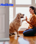 Door with draft stopper and sweep, grey large sponge seal, windows and doors weatherproofing, woman and dog beside