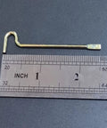 Single emergency key for interior privacy doors next to a ruler, showing size and durable metal construction for bedroom and bathroom use.