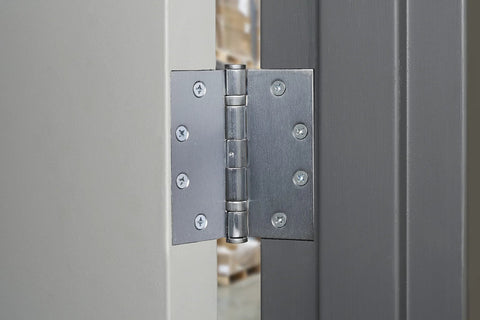 Commercial 4 Pack 4.5 Inch Ball Bearing Door Hinges Satin Chrome Finish installed on metal door frame