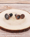 Heavy Duty 200 Degree Door Peephole Viewer with Rotating Privacy Cover, brushed antique copper finish on wooden background.