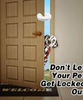 Front view of a six pack baby door pinch guard installed on a wooden door, preventing slams and protecting fingers, with a dog peeking through.