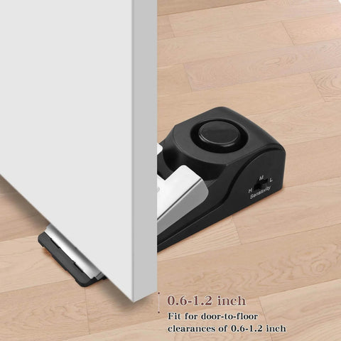 Door Stop Alarm with 120DB Siren Door Stop for Home & Travel (Black) placed under a door, showing fit for 0.6-1.2 inch gap