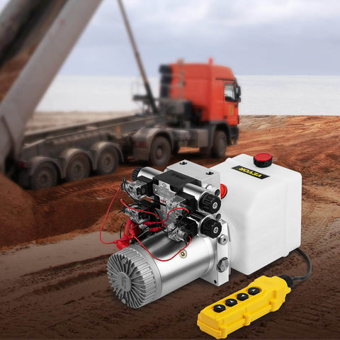 Double Acting 4 Way Hydraulic Pump Power Unit With 12V DC Motor 2 GPM Flow 3200 PSI Max next to a dump trailer in operation