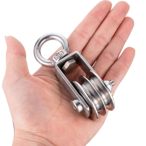 Person holding SHINICO Double Cable Pulley Block Heavy Duty Stainless Steel, Bearing Inside, Swivel Single Pulley Wheel, 550lb load