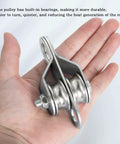 Hand holding Double Pulley Block Small Snatch Cable for 0.23Inch/6mm Wire Rope, Pulley Wheel Bearing Inside, 2Pack
