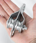 Hand holding Double Cable Pulley Block, with Ball Bearings for 0.23 Inch/6mm Wire Rope, Good for Pulley Lifing System, 1Pack