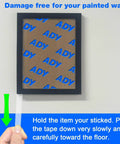 Heavy Duty Clear Double Sided Foam Tape For Wall Mounting Removable No Residue Damage Free Paint Safe Hang Posters Office Use 1In By 20Ft Roll 1.1Mm Thick Transparent Great For Pictures And Decor being removed from wall with picture frame.