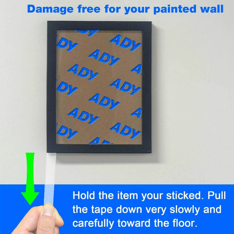 Heavy Duty Clear Double Sided Foam Tape For Wall Mounting Removable No Residue Damage Free Paint Safe Hang Posters Office Use 1In By 20Ft Roll 1.1Mm Thick Transparent Great For Pictures And Decor being removed from wall with picture frame.