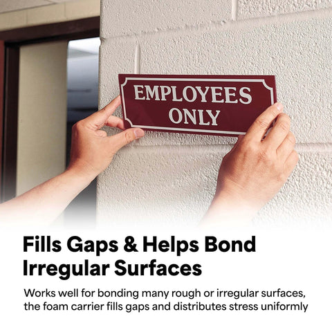 Person mounting 'Employees Only' sign on a textured wall with Double Sided Urethane Foam Tape Go To Bonding And Mounting, Gap Filling With Strong Acrylic Adhesive, White, 0.75 Inch By 5 Yard Roll, Ideal For Textured Surfaces, High Hold Power, Durable And Versatile.