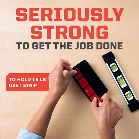 Hands applying Extreme Mounting Strips Double Sided Heavy Duty Tape 16 Pack 1 In By 3 In Indoor Outdoor Black