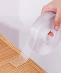 Double Sided Nano Tape 2 Inch By 33 Feet Heavy Duty Mounting Gel Tape Clear Traceless rolled out on wooden surface
