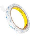 Double Sided Tape 0.5 Inch By 32.8 Feet Thin Translucent Removable Adhesive roll with protective film partially peeled off