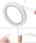 Two Rolls Of One Quarter Inch Six Millimeter Double Sided Adhesive Tape For Arts And Crafts Scrapbooking Card Making Gift Wrapping DIY Projects Photography And Office School Supplies Easy To Peel Yet Strong Hold And Removable By Hand shown in close-up