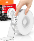 Hand holding Extra Large Double Sided Tape Heavy Duty Removable 1.18 Inch By 160 Inch Clear Nano Tape for picture hanging.