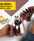 Craft project with accordion paper dog figure and Double Sided Tape With Dispenser For Gift Wrapping And Arts And Crafts in view