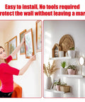 Person using Heavy Duty Double Sided Tape Waterproof Foam Mounting Tape to hang picture on wall