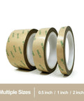 Three rolls of brown tape with green text, in sizes 0.5 inch, 1 inch, and 2 inch, displayed on a white background.