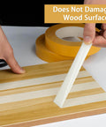Heavy Duty Double Sided Woodworking Tape, 1 Inch Wide By 75 Feet, Two Pack, being removed from wood without residue