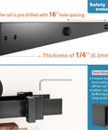 Close-up of black rail and stopper for Double Track Bypass Sliding Barn Door Hardware Kit For Two Doors, 1/4-inch thick.