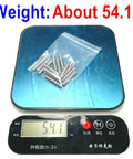 Heavy Duty 3/16 Inch By 1 Inch Dowel Pins 15 Pack on scale showing weight of 54.1g