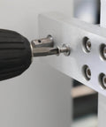 Close-up of a drill installing a screw into metal with Nuts And Bolts Assortment Kit 900 Pcs Stainless Steel 304 Nuts Bolts Washers Screws Set