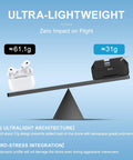 Ultra-lightweight drone airdrop system on balance scale showing 31g weight, illustrating zero impact on flight stability.