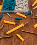 270 Pcs Drywall Anchors and Screws Assortment Kit with 135 Plastic Expansion Wall Anchors and 135 Phillips Flat Head Wood Screws in 5 Common Sizes on a wooden surface.