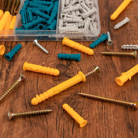 270 Pcs Drywall Anchors and Screws Assortment Kit with 135 Plastic Expansion Wall Anchors and 135 Phillips Flat Head Wood Screws in 5 Common Sizes on a wooden surface.