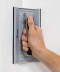 Person using Drywall Corner Sander Kit With Two Sided Pad And Six Sandpapers Included to smooth a wall corner