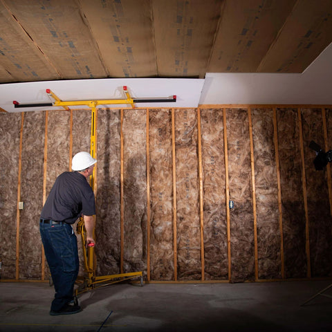 Worker using Drywall Lift, The Original, Professional-Grade Sheetrock Hoist 138-2, 150 lbs for ceiling installation, Made in USA