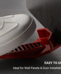 Close-up of red XL Sheetrock Kicker in use, part of (2-Pack) XL Drywall Lift & Sheetrock Kicker Multi-Tool Set with Built-In Drywall Rasp Tool & Bottle Opener