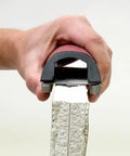 Efficient 5.5 inch drywall rasp with guard rails shaping plaster edge, DuraSoft grip for dual-direction use, precise finish.