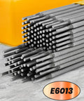 E6013 Welding Rod 3/32 Inch 5 Pound Carbon Steel Stick Electrodes For AC And DC Welding, stacked metal rods on concrete surface