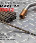 Close-up of E6013 Three Thirty Second Inch 5Lb Carbon Steel Stick Electrodes Welding Rod on metal surface with welding accessory in background.