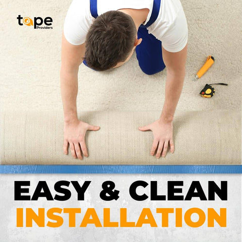 Man installing carpet with Heavy Duty Double Sided Carpet Tape 2 Inch By 25 Feet Keeps Rugs In Place Indoors And Outdoors Non Slip