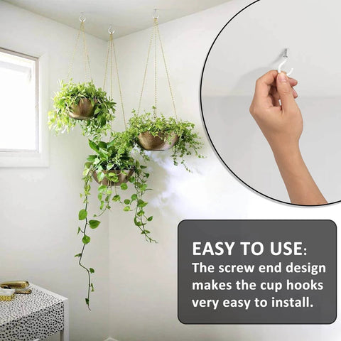 Hand installing cup hook in wall with three hanging plants shown, featuring easy-to-use design.