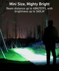 Person using Rechargeable EDC Flashlight With USB C Port, 360 Lumen Mini Keychain Light at night, illuminating a path