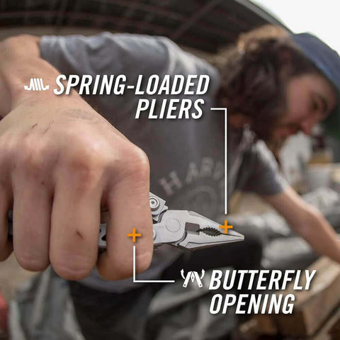 Man using Suspension-NXT 15-In-1 EDC Multi Tool with needle nose pliers and spring-loaded butterfly opening in an outdoor setting.