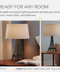 Parisian Inspired Eiffel Tower Table Lamp With Black Acrylic 3D Base And Natural Fabric Shade For Bedside Desk Or Living Room A Dope Pick For Farmhouse Rustic Boho And Industrial Decor in a living room setting.