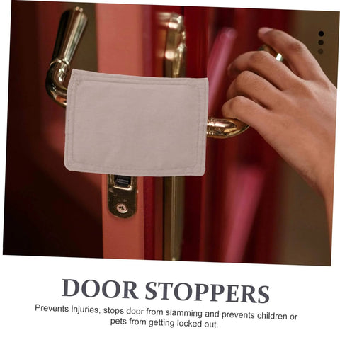 Soft door silencers and closers with elastic straps on door handle preventing slamming and finger injuries. Protects surfaces.