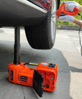 Fast 5-Ton Electric Car Jack Kit With 12V Hydraulic Lift And Impact Wrench For SUV MPV Sedan And Truck, lifting a car