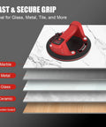 8 Inch Electric Glass Vacuum Suction Cup Lifter on stacked materials, showing use on marble, metal, glass, ceramic, and wood surfaces.